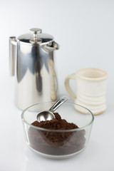 Coffee Press and Coffee Mug with Fresh Grounds