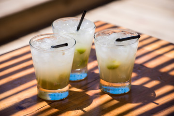 Three cold delicious caipirinhas ready to drink