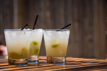 Three cold delicious caipirinhas ready to drink