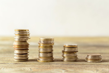 coins stack on wooden table