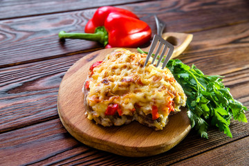 Pork chop with cheese and red pepper 