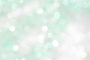 Brilliant green background with blurry circles. A beautiful summer pattern for a holiday greeting card.