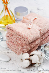 Fototapeta na wymiar SPA or welness concept with cotton towels, soap and sea salt