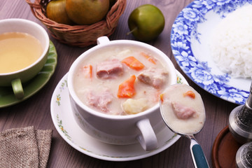 A bowl of creamy pork stew. 