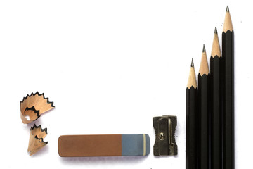 pencils with a sharpener and eraser , isolated on white background