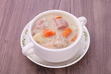 A bowl of creamy pork stew. 