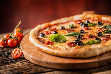 Pizza. Tasty fresh italian pizza served on old wooden table