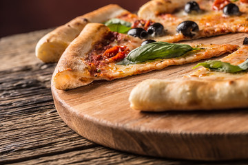 Pizza. Tasty fresh italian pizza served on old wooden table