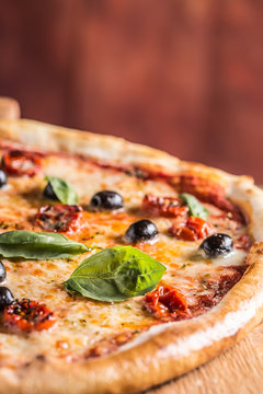 Pizza. Tasty fresh italian pizza served on old wooden table