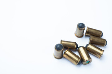 Vintage rubber bullets on a white background, blank space for text.