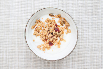 Yogurt with granola in a bowl, Top view, Healthy and Clean food