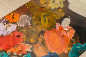 closeup of Wooden palette covered with multicolored paint