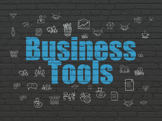 Finance concept: Painted blue text Business Tools on Black Brick wall background with  Hand Drawn Business Icons