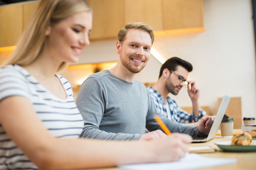 Fototapeta premium Positive young people studying