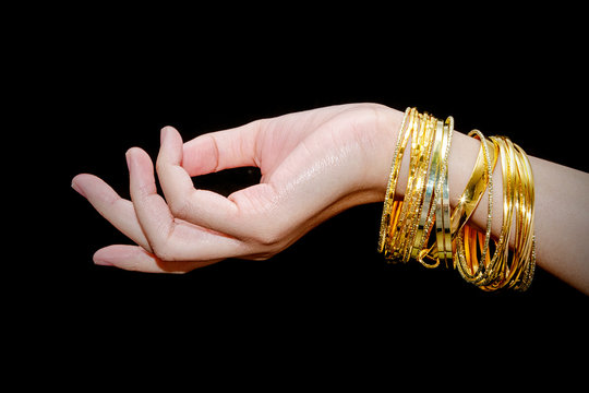 Beautiful Woman Hand Hold Gold Bracelet Jewelry, Accessory And Fashion.