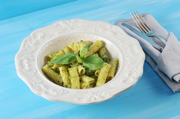 pasta with pesto sauce and Basil in plate