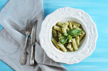 pasta with pesto sauce and Basil in plate