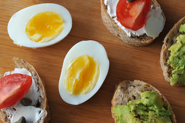 canape sandwiches on a wooden Board