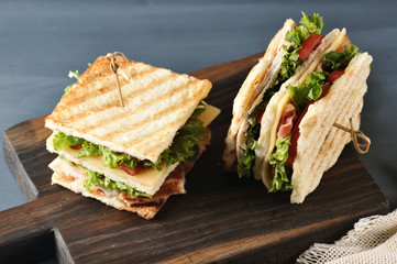 sandwich with bacon, chicken breast and lettuce