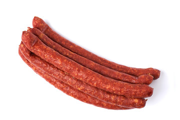 Thin smoked sausages isolated on a white background