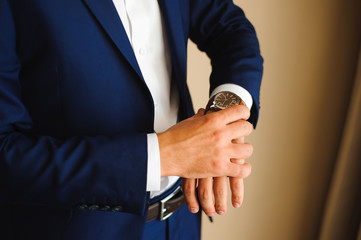 businessman looking at his watch