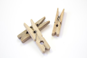 Wooden clothespin on a white background