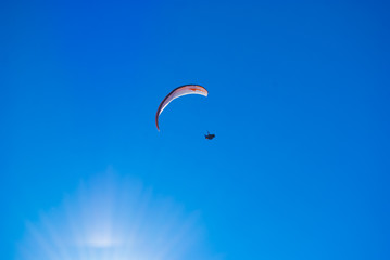 Paragliding in the blue sky