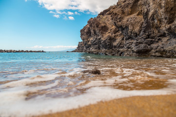 Canary Islands. Beautiful beaches on a sunny day on the island of Tenerife. Shores of the atlantic ocean.