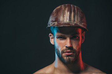 Fototapeta premium Architect, worker, engineer - work. Portrait of handsome engineer. Business, building, industry, technology - builder concept. Portrait of mechanical worker. Copy space for advertise.