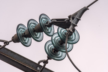 Electric pole with power line. Power pole with external electric separator on top isolated on white background. Concept: electricity and electricity supply