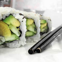 Green vegan sushi rolls with vegetables
