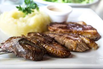 juicy steak veal beef meat with tomato and potatoes