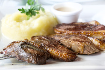 juicy steak veal beef meat with tomato and potatoes