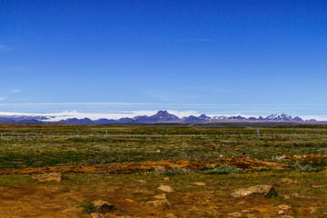 Mountains, volcanic fields and blue sky in Iceland