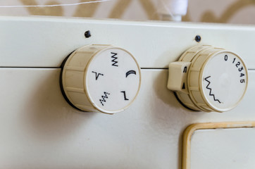 A closeup of a sewing machine, an old sewing machine.