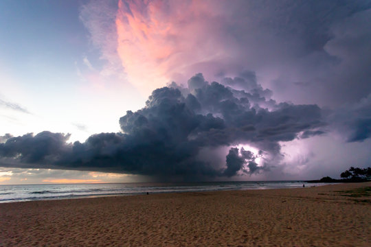Ahungalla Beach, Sri Lanka - Thunder and lightning during sunset at the beach of Ahungalla