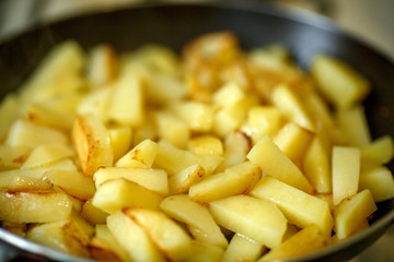 cooking of fried potatoes or French fries in a frying pan