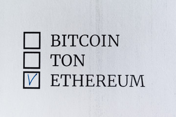 Questionnaire. Blue pen ink and the inscription "BITCOIN TON ETHEREUM" with cross on the white paper