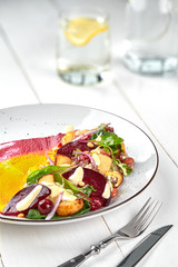 Healthy diet: colorful beetroot salad with potatoes and shredded leaves.