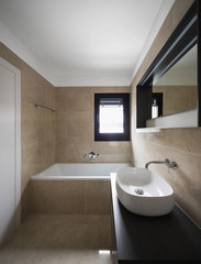 Detail of sink and bathtub. Interior bathroom, nobody inside very new and modern
