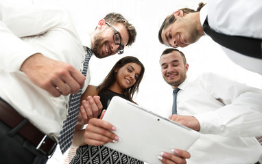 Fototapeta na wymiar closeup of business team looking at digital tablet.