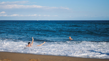Fototapeta na wymiar People tourists on the sea beach. Catalonia Barcelona Spain