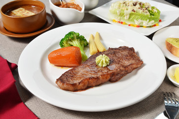 New York Steak served with salad and soup