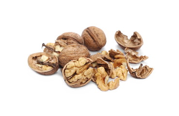 Cracked walnuts isolated on white background