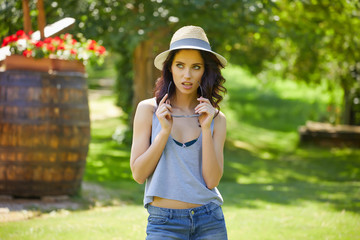 Fototapeta premium Young woman on the background of the Italian house