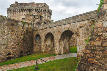 Ancient walls of Chateau de Dinan, medieval castle built in 14th century that consists of keep and ramparts, in Dinan, Brittany, France