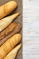 different types of baguette on a wooden background