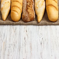different types of baguette on a wooden background