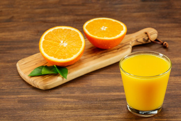 Still Life Glass of Fresh Orange Juice on Vintage Wood Table with Copy Space.