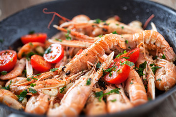 Scampi cooked with tomatoes and parsley